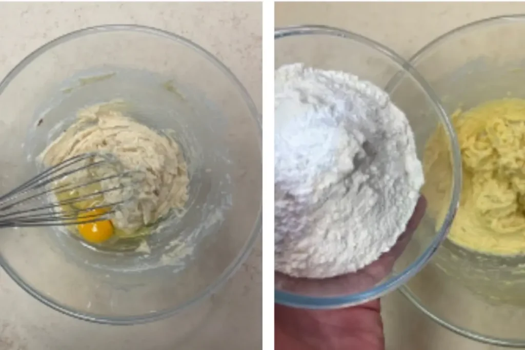 An egg yolk and vanilla extract are added to the creamed butter and sugar mixture in the glass bowl, ready to be mixed .